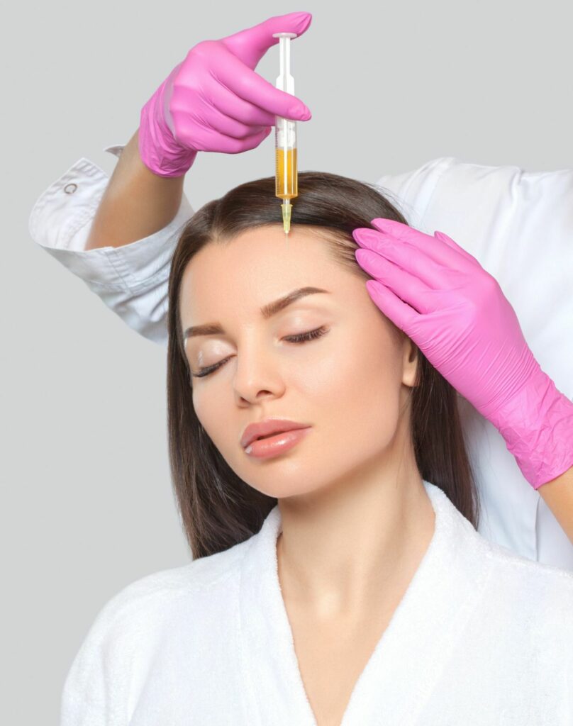 Young Female Receiving Hair-restoration Treatment | Imagine Medspa in Winter Garden, FL